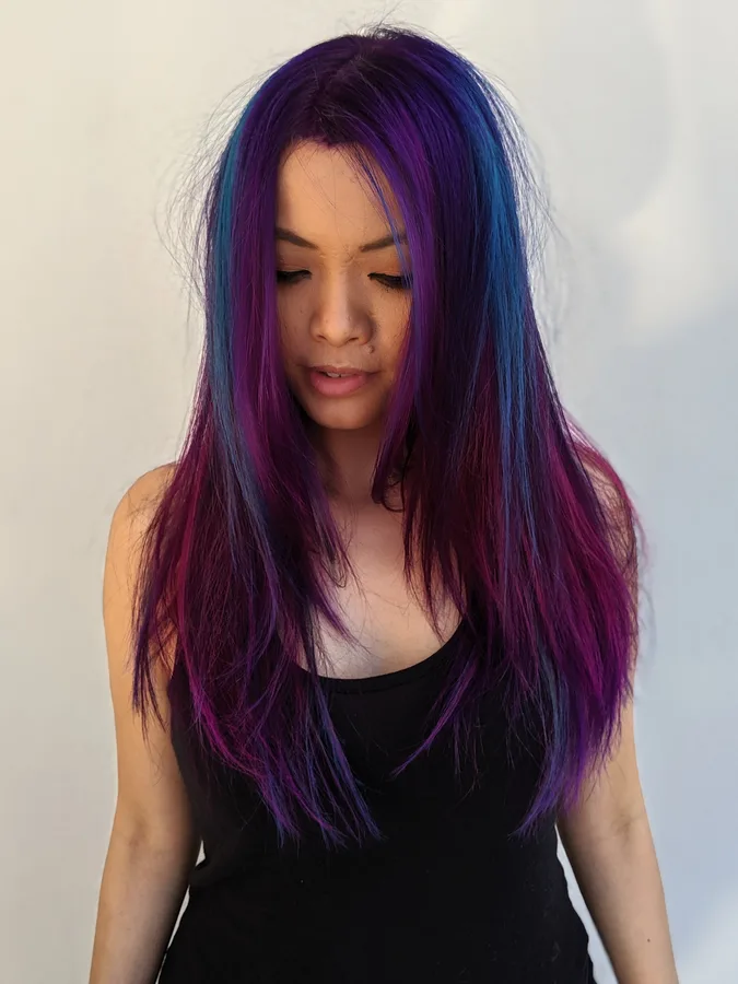 Long straight hair in blended purple, blue and magenta tones